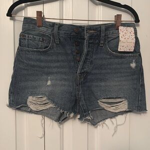 Brand new Free people size 25 denim mid rise ripped shorts.